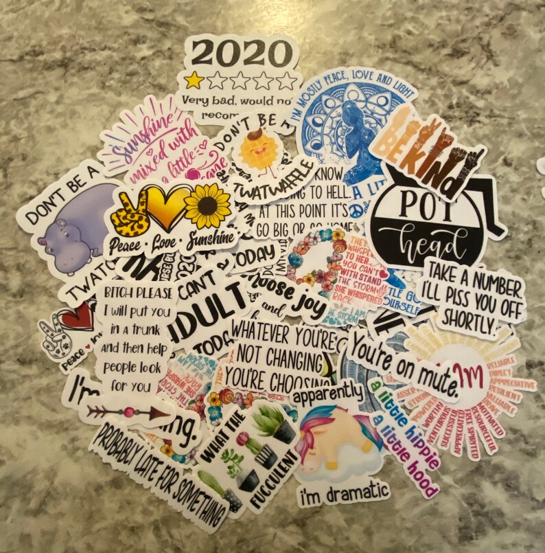 May include: A collection of colorful stickers with various phrases and designs, including "Don't Be A Twatwaffle", "Peace Love Sunshine", "Pot Head", "I'm Dramatic", "You're On Mute", "A Little Hippie", "A Little Hood", "2020", "Probably Late For Something", "What The", "Today I Choose Joy", "Whatever You're Not Changing", "You're Choosing Apparently", "Bitch Please I Will Put You In A Trunk And Then Help People Look For You", "Take A Number I'll Piss You Off Shortly", "I'm Mostly Peace Love And Light", "The Magic To Her You Can't With Stand The Storm She Whispered Back", "I'll Stand Up For Myself", "I'm A Little Spoiled", "Motivated", "Resourceful", "Valuable", "Reliable", "Appreciative", "Present", "Successful", "Worthy", "Motivated", "Free Spirited", "I'm A Little Spoiled", "Motivated", "Resourceful", "Valuable", "Reliable", "Appreciative", "Present", "Successful", "Worthy", "Motivated", "Free Spirited".