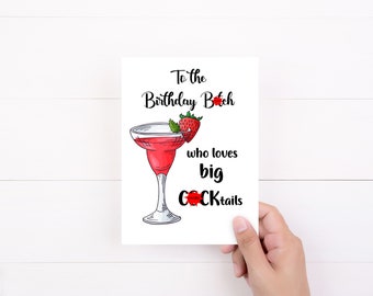 May include: A white greeting card featuring a hand-drawn illustration of a red strawberry-garnished cocktail in a glass. The text reads: To the Birthday B*tch who loves big C*CKtails, with red starbursts obscuring parts of the words.