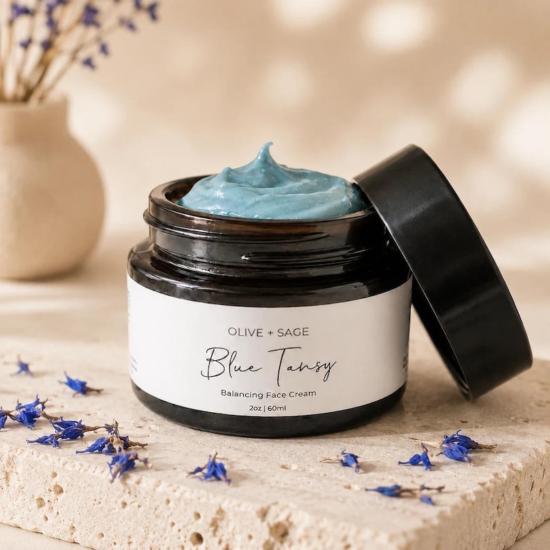 Organic blue tansy face cream for sensitive skin in glass jar, calming botanical moisturizer