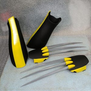 May include: A set of black and yellow Wolverine claws with silver blades. The claws are made of foam and are designed to look like the claws from the X-Men comics and movies.