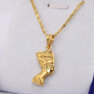 Gold Egyptian Charm
handmade jewelry
18K Gold Pendants
egyptian jewelry
egyptian necklace
pharaoh pendant
egypt gold pendant
gold pendant chain
18K gold pendant
egyptian nefertiti
nefertiti pendant
Queen Nefertiti
18k gold chain
Nefertiti necklace