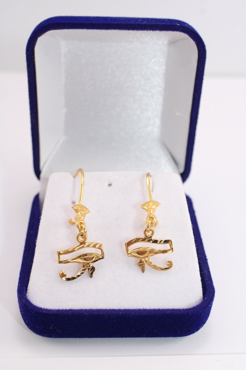 Egyptian Solid Gold 18K Earring Eye Of Horus Stamped Pharaonic Yellow Gold handmade jewelry
egyptian jewelry
ancient Egypt
Eye of Horus Earring
eye of ra
evil eye Earring
Solid Gold 18K
Gold Stamped
Eye of Horus
Stamped Earring
18K gold
evil eye