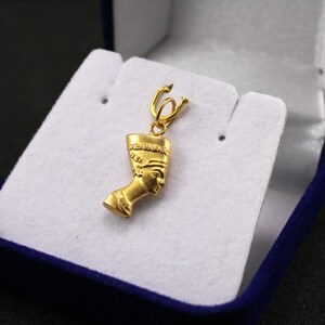Gold Egyptian Charm
egyptian jewelry
egyptian pendant
ancient Egypt
egyptian gold 
pharaoh pendant
egypt gold pendant
gold pendant 
18K gold pendant
egyptian nefertiti
nefertiti pendant
nefertiti 18Kgold
Queen Nefertiti
Egypt mythology
Egyptian Queen