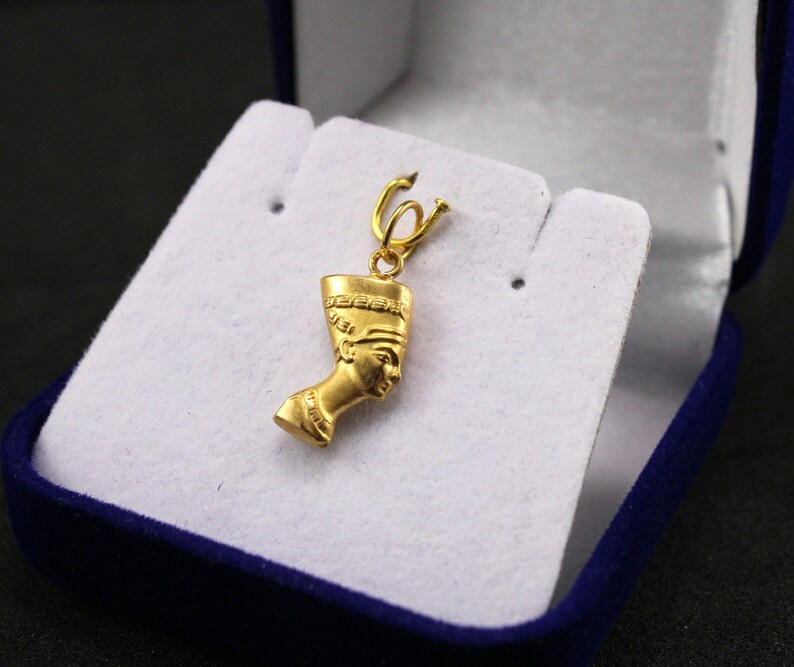 Gold Egyptian Charm
egyptian jewelry
egyptian pendant
ancient Egypt
egyptian gold 
pharaoh pendant
egypt gold pendant
gold pendant 
18K gold pendant
egyptian nefertiti
nefertiti pendant
nefertiti 18Kgold
Queen Nefertiti
Egypt mythology
Egyptian Queen