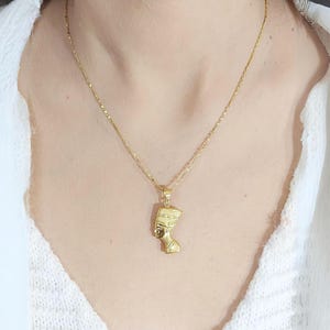 Gold Egyptian Charm
handmade jewelry
18K Gold Pendants
egyptian jewelry
egyptian necklace
pharaoh pendant
egypt gold pendant
gold pendant chain
18K gold pendant
egyptian nefertiti
nefertiti pendant
Queen Nefertiti
18k gold chain
Nefertiti necklace