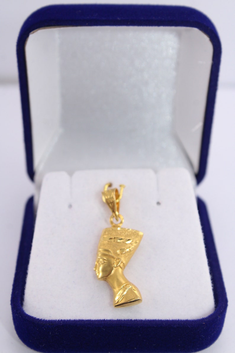 Gold Egyptian Charm
handmade jewelry
18K Gold Pendants
egyptian jewelry
egyptian necklace
pharaoh pendant
egypt gold pendant
gold pendant chain
18K gold pendant
egyptian nefertiti
nefertiti pendant
Queen Nefertiti
18k gold chain
Nefertiti necklace