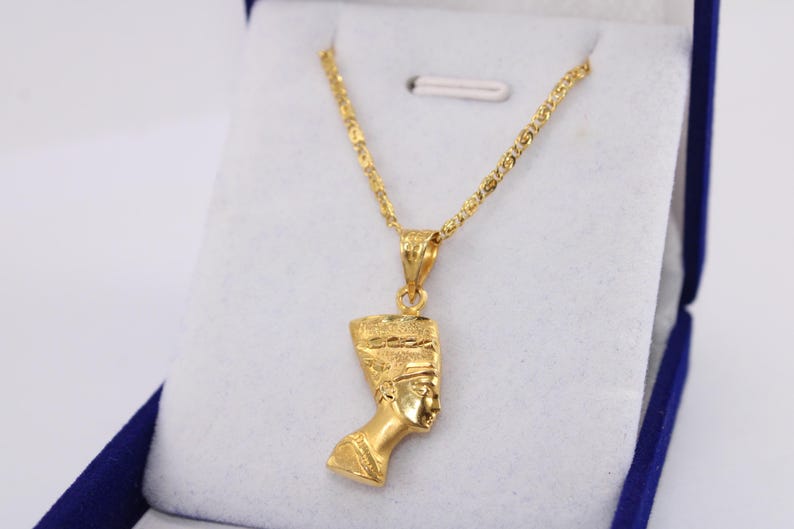 Gold Egyptian Charm
handmade jewelry
18K Gold Pendants
egyptian jewelry
egyptian necklace
pharaoh pendant
egypt gold pendant
gold pendant chain
18K gold pendant
egyptian nefertiti
nefertiti pendant
Queen Nefertiti
18k gold chain
Nefertiti necklace