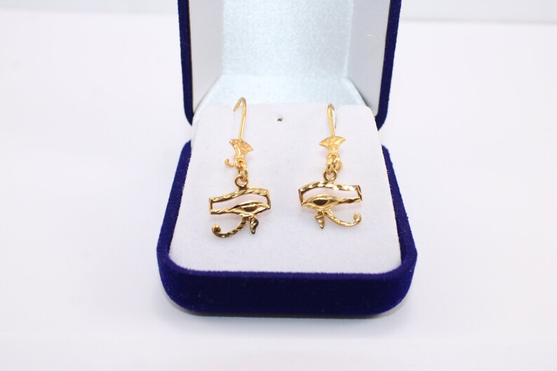 Egyptian Solid Gold 18K Earring Eye Of Horus Stamped Pharaonic Yellow Gold handmade jewelry
egyptian jewelry
ancient Egypt
Eye of Horus Earring
eye of ra
evil eye Earring
Solid Gold 18K
Gold Stamped
Eye of Horus
Stamped Earring
18K gold
evil eye