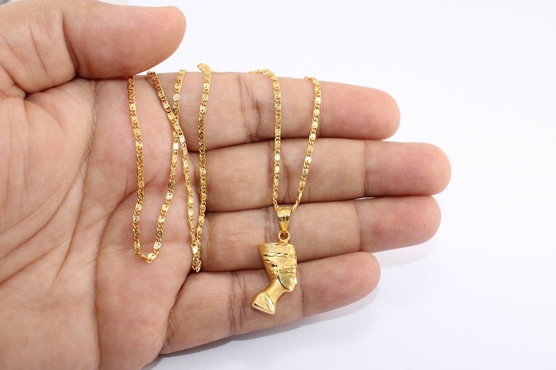 Gold Egyptian Charm
handmade jewelry
18K Gold Pendants
egyptian jewelry
egyptian necklace
pharaoh pendant
egypt gold pendant
gold pendant chain
18K gold pendant
egyptian nefertiti
nefertiti pendant
Queen Nefertiti
18k gold chain
Nefertiti necklace
