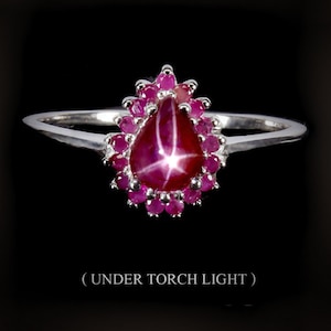 Anillo de rubí estrella con halo: lágrima natural, oro blanco de 18 k y plata. Tallas 7 y 7,75.