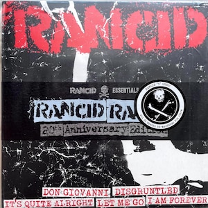 May include: A black and white album cover with the band name "Rancid" in red letters. The album is titled "Rancid Rancid 20th Anniversary Edition" and features the song titles "Don Giovanni", "Disgruntled", "It's Quite Alright", "Let Me Go", and "I Am Forever".