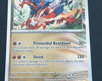 May include: A Koraidon trading card featuring the red and blue creature in a dynamic pose. The card displays 140 HP, the Ancient label, and attacks named Primordial Beatdown and Shred. Text includes No. 1007 Paradox Pokémon, HT 8'2", WT 668 lbs.