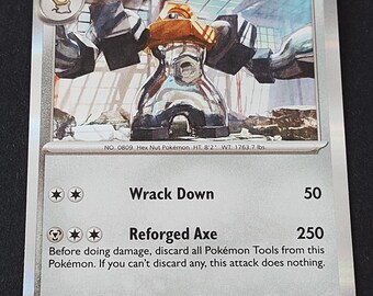 May include: A silver-colored Melmetal trading card featuring a metallic creature with a nut-shaped head and large arms. The card displays 160 HP, the attacks Wrack Down and Reforged Axe, and includes text detailing the Pokémon's abilities and stats.