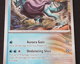 May include: A Walking Wake trading card featuring a blue and purple creature with an Ancient label, 130 HP, and water energy symbol. The card displays the attacks Aurora Gain and Undulating Slice, with text detailing the Pokémon's stats and abilities.