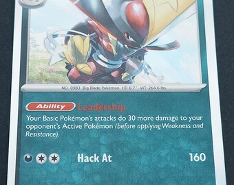 May include: A Kingambit trading card featuring the Big Blade Pokémon with 170 HP. The card displays the Leadership ability and the Hack At attack. It includes the text No. 0983, height 6'7", weight 264.6 lbs, and the illustrator name Anesaki Dynamic.