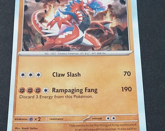 May include: A Koraidon trading card featuring a red and blue creature illustration, 130 HP, and the attacks Claw Slash and Rampaging Fang. The card displays the text No. 1007 Paradox Pokémon, 124/198, and details about the Winged King in the bottom corner.