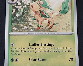May include: A Leafeon trading card with 120 HP, featuring a tan creature with green leaf-like accents standing near white flowers. The card text includes Leaflet Blessings and Solar Beam attacks, with the number 005/131 and 2025 copyright.