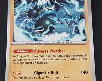 May include: A Thundurus trading card with 110 HP, featuring a blue, muscular creature with spiked spheres surrounded by lightning. The card text includes the ability Adverse Weather and the attack Gigantic Bolt, with a weakness to fighting types.