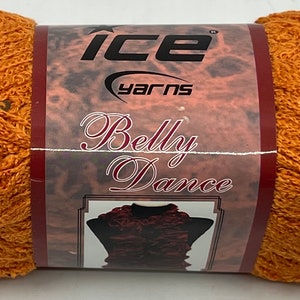 May include: A skein of orange yarn with a label that reads "ICE Yarns Belly Dance".