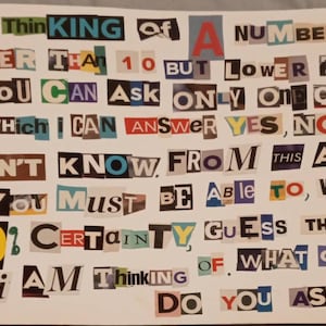 May include: A white card with colorful cut-out letters that read: "I am thinking of a number higher than 10 but lower than 14. You can ask only one question to which I can answer yes, no or I don't know. From this answer you must be able to, with 100% certainty, guess the number I am thinking of. What question do you ask?"