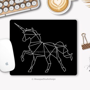 White origami unicorn mouse pad on black background, rectangle or round, non-slip. Ideal for a desk decoration or gift.