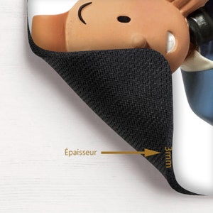 May include: A black mouse pad with a cartoon character design. The mouse pad is 3mm thick and has a textured surface.