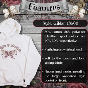 a white hoodie with a butterfly on it