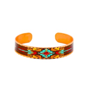 May include: A copper bracelet with a colorful geometric design. The design features turquoise, red, orange, and yellow colors on a brown background.