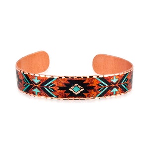 May include: A copper cuff bracelet featuring a textured, mottled orange and brown background. The surface is decorated with a repeating geometric pattern in solid black and bright turquoise, finished with scalloped edges along the top and bottom.
