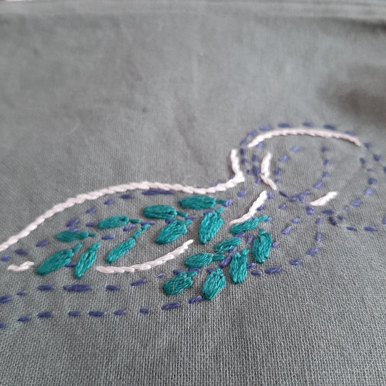Medusa embroidered pouch