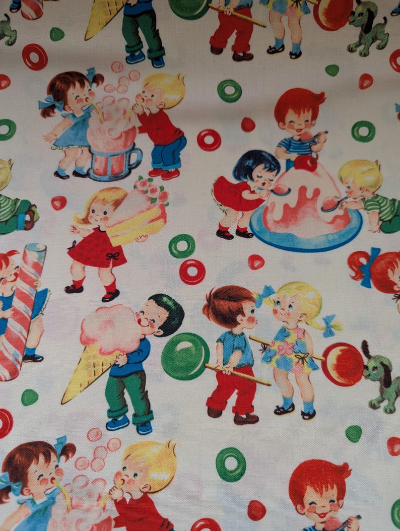 May include: A white fabric with a repeating pattern of vintage illustrations. The design features children enjoying sweets like ice cream cones, sundaes, and lollipops. Colorful candies and green dog figures are also scattered across the fabric.