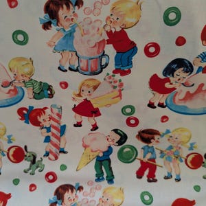 May include: White fabric with a repeating pattern of children enjoying treats. The illustrations feature kids in various outfits, with cotton candy, ice cream cones, and lollipops. Red, green, and pink candies and bubbles are scattered across the background.