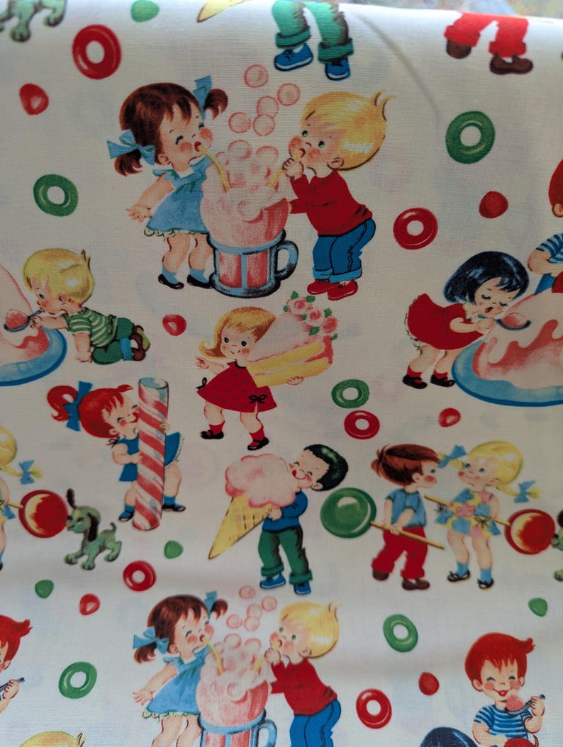 May include: White fabric with a repeating pattern of children enjoying treats. The illustrations feature kids in various outfits, with cotton candy, ice cream cones, and lollipops. Red, green, and pink candies and bubbles are scattered across the background.