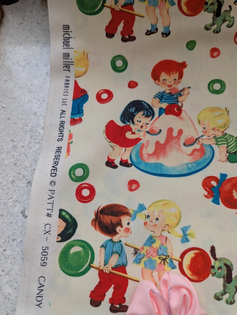 May include: Fabric with a repeating pattern of children, candy, and ice cream on a cream background. The children are depicted in vintage style, with red, blue, and yellow clothing. The fabric includes the text "michael miller FABRICS LLC. ALL RIGHTS RESERVED &copy; PATT# CX-5059 CANDY."