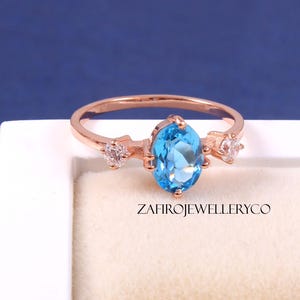 Swiss Blue Topaz Ring: Oval Sterling Silver December Birthstone