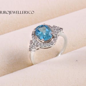 Handmade Swiss Blue Topaz Ring: Sterling Silver Halo, December Birthstone
