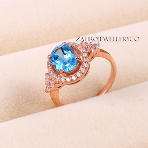 Handmade Swiss Blue Topaz Ring: Sterling Silver Halo, December Birthstone