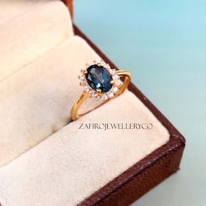London Blue Topaz Ring: Oval Gemstone, Zircon Halo, Sterling Silver