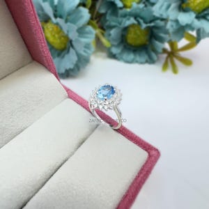 Swiss Blue Topaz Halo Ring: Sterling Silver Engagement Ring