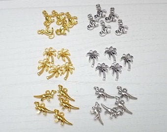 5 Anhänger "Äffchen", "Palme" oder "Dino" in silber oder gold