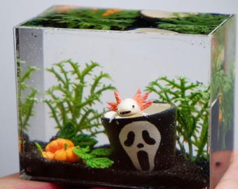 Miniature clay axolotl tank in halloween theme