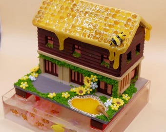 Miniature honey house with seafish tank