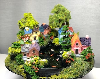 Pueblo en miniatura con peces koi