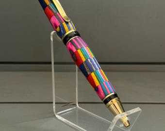 The SpectraColor - A Cigar Pen, made of upcycled Spectraply pieces, with gold trim