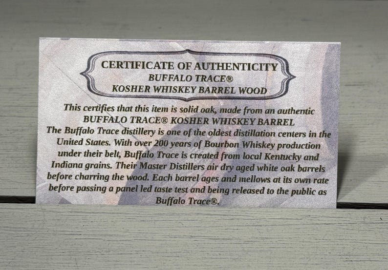 May include: A certificate of authenticity for Buffalo Trace Kosher Whiskey Barrel Wood. The text states the item is solid oak from an authentic Buffalo Trace Kosher Whiskey Barrel. The distillery is one of the oldest in the United States.