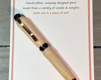 The Strawberry Fields - a handcrafted cigar-style pen made of Bird’s Eye Maple wood with copper trim