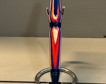 FIRECRACKER! - A handcrafted Cigar-style Pen of red, white and blue composite wood with Blue Galaxy Trim.