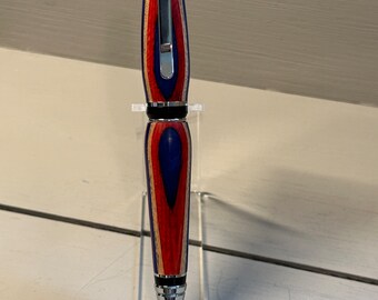 A SLICE OF AMERICANA - A handcrafted Cigar-style Pen of red, white and blue composite wood with Chrome Trim.