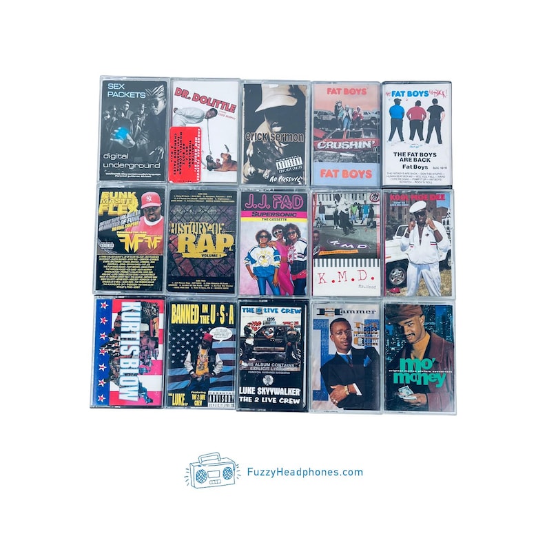 May include: A collection of vintage cassette tapes featuring various artists and album titles. The tapes showcase a variety of genres, with text including "SEX PACKETS", "DR. DOLITTLE", "FAT BOYS", and "KURTIS BLOW". The image includes the website "FuzzyHeadphones.com".