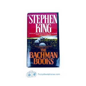 May include: A hardcover book titled "The Bachman Books" by Stephen King. The cover features a red and black design with the author's name prominently displayed. The book includes an introduction by the author.